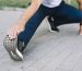 man-stretching-his-leg-park-alley